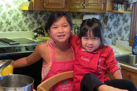 Kasen and Karis helping with cooking